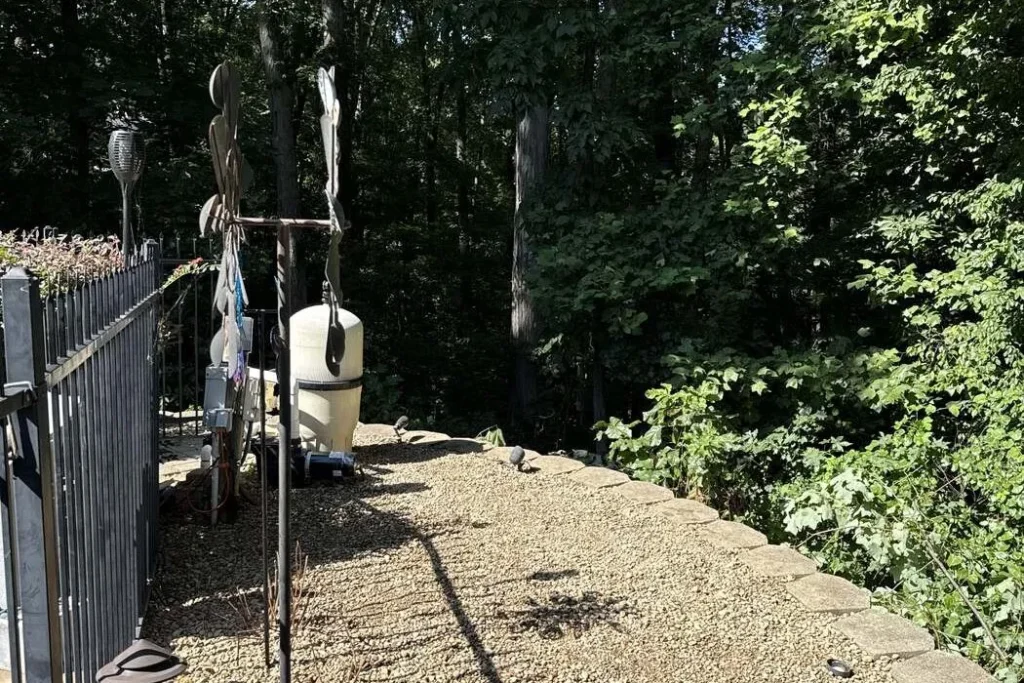 Gravel path laid along a fence line to carry water away from the yard